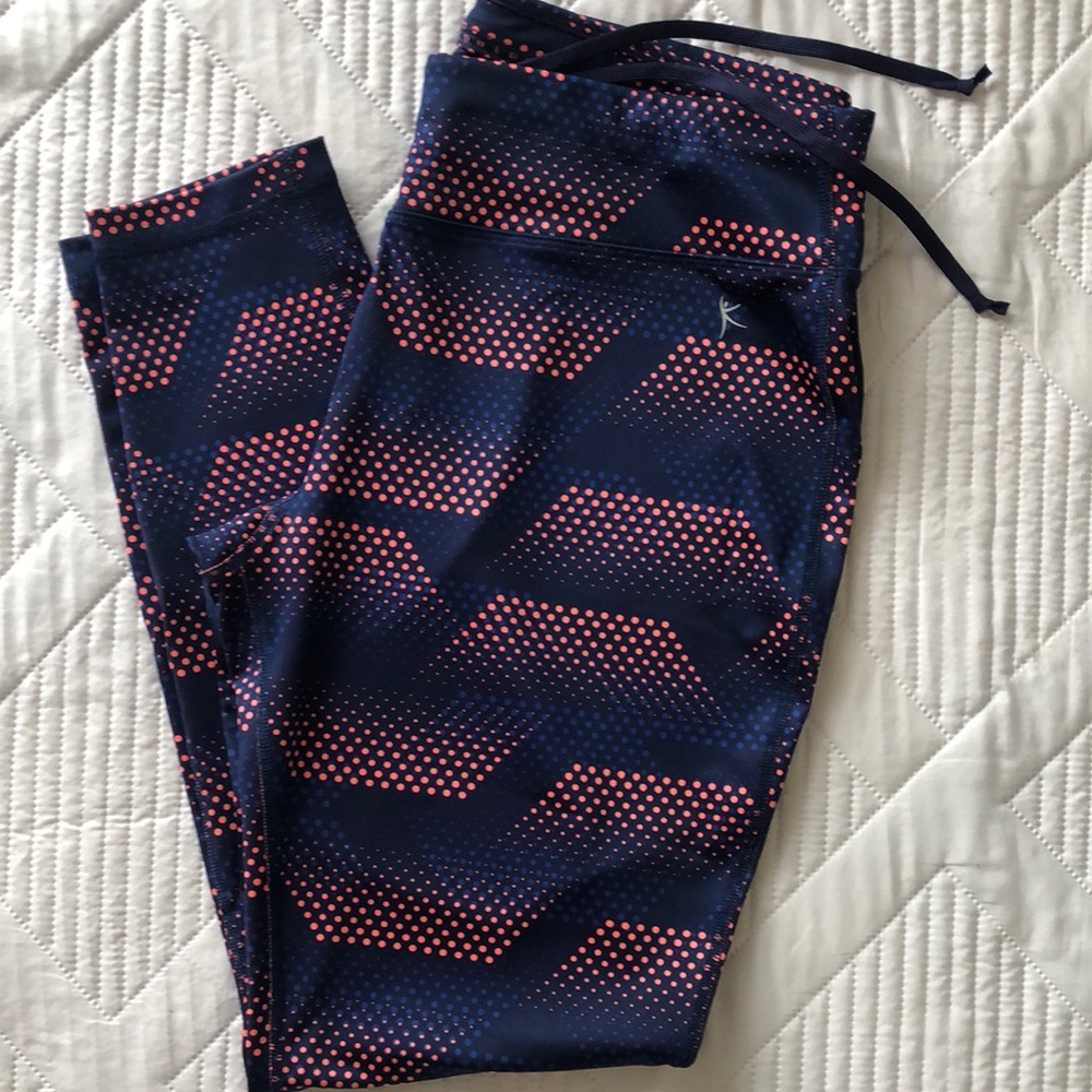 Danskin women’s Vibrant Blue and Pink Athletic Leggings with Dynamic Stripes.